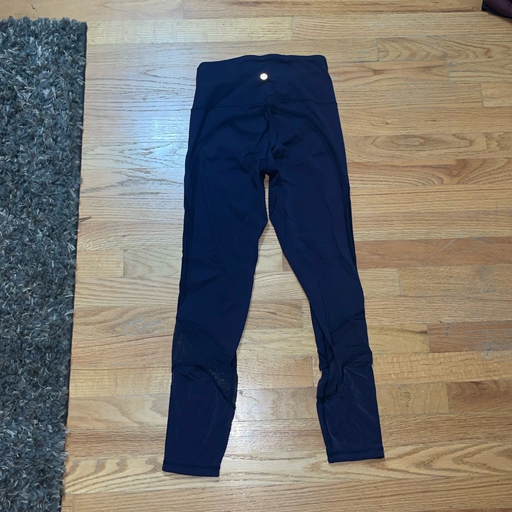 Lululemon navy tights with mesh around the calves